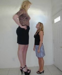 Two women. One of whom is much taller than the other.